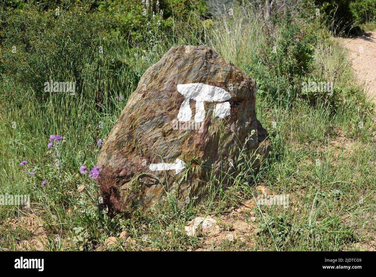 Painted Direction Sign & Motif Leading to or Pointing to the Dolmen of Gaoutabry near La Londe Var Provence France Stock Photo