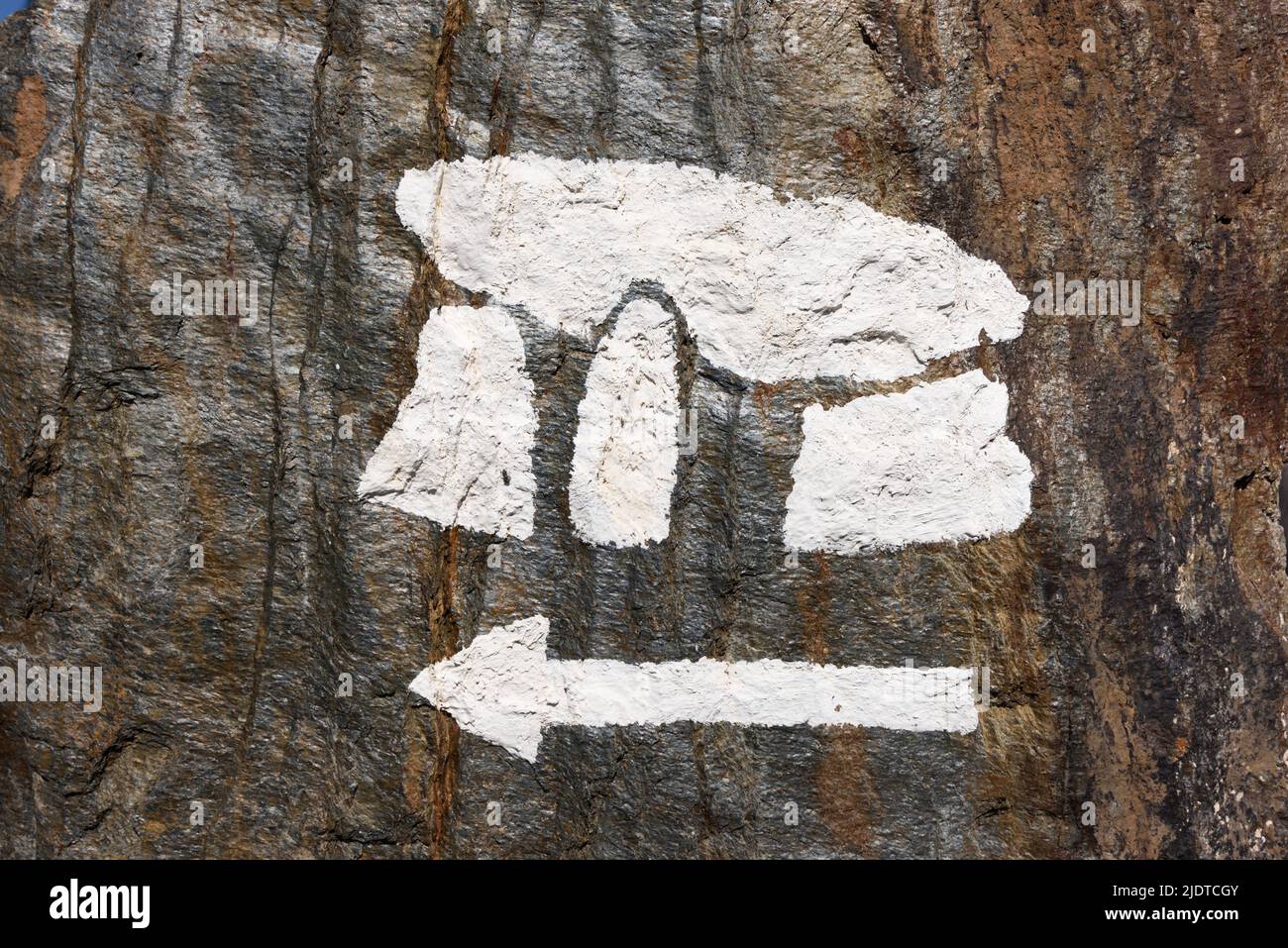 Sign or Symbol of Stylised Dolmen Painted on Boulder & Pointing to the Dolmen of Gaoutabry La Londe Var Provence France Stock Photo