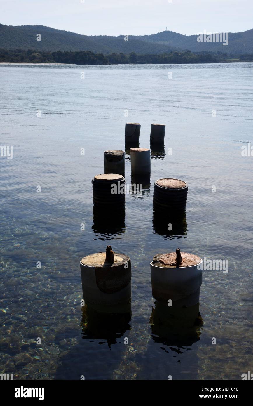 Old Pillars of Ruined or Abandoned Jetty off Coast of the Plage de La Vinasse Bormes-les-Mimosas Mediterranean Coast Côte-d'Azur French Riviera France Stock Photo