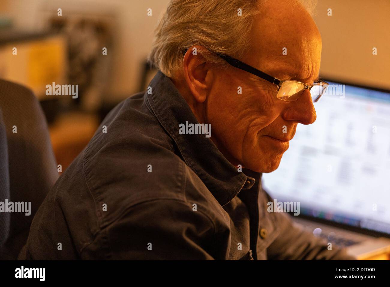 Senior man working at desk Stock Photo