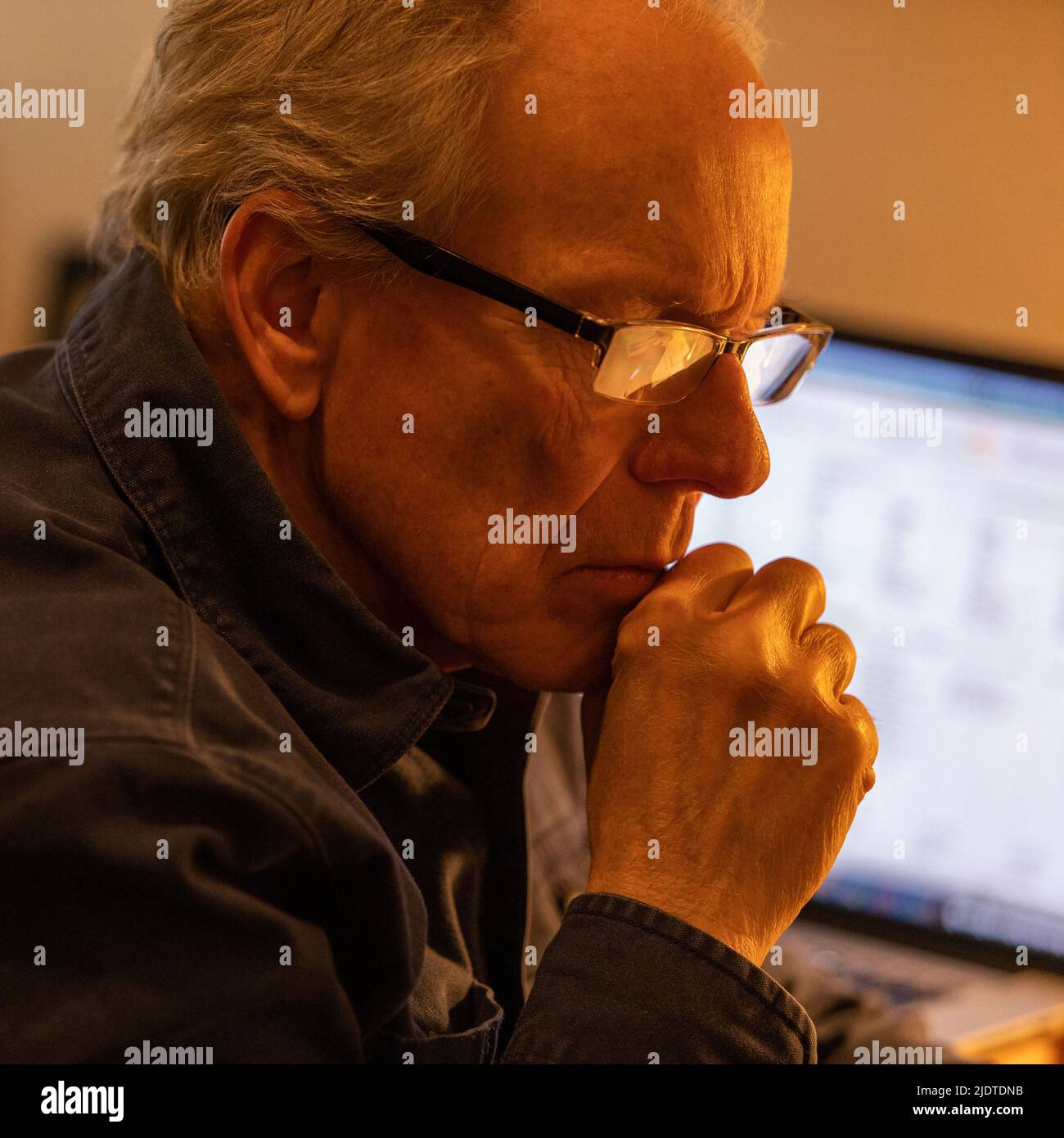 Senior man working at desk Stock Photo