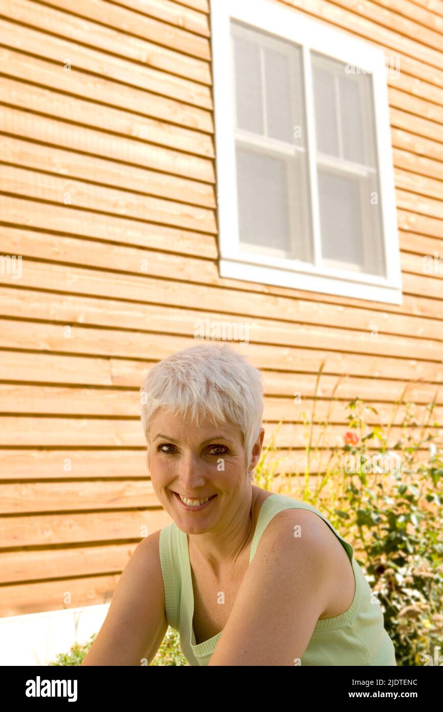 Mature woman standing in front hi-res stock photography and images - Alamy