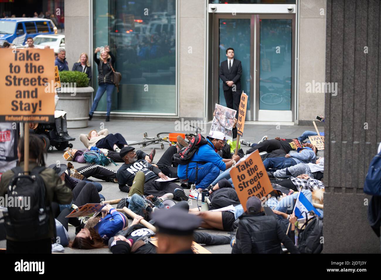 Manhattan, New York,USA - October 26. 2019: People protesting in front of Fox News building in NYC. Donald Trump protest in Manhattan. People lying on Stock Photo
