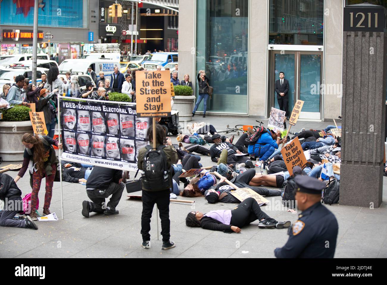 Manhattan, New York,USA - October 26. 2019: People protesting in front of Fox News building in NYC. Donald Trump protest in Manhattan. People lying on Stock Photo