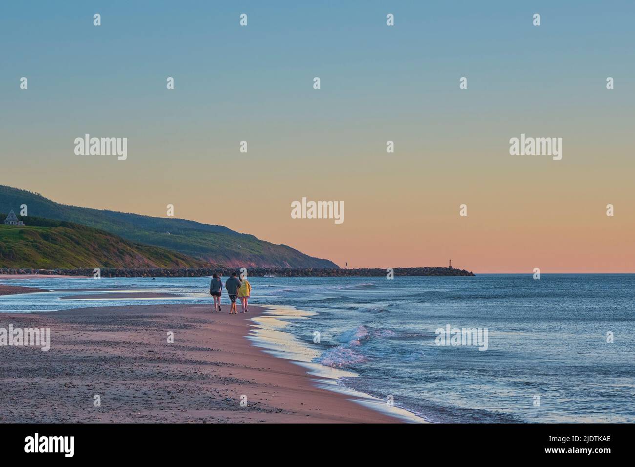 People out enjoying a beautiful summer evening sunset on Inverness Beach Cape Breton Nova Scotia. Stock Photo