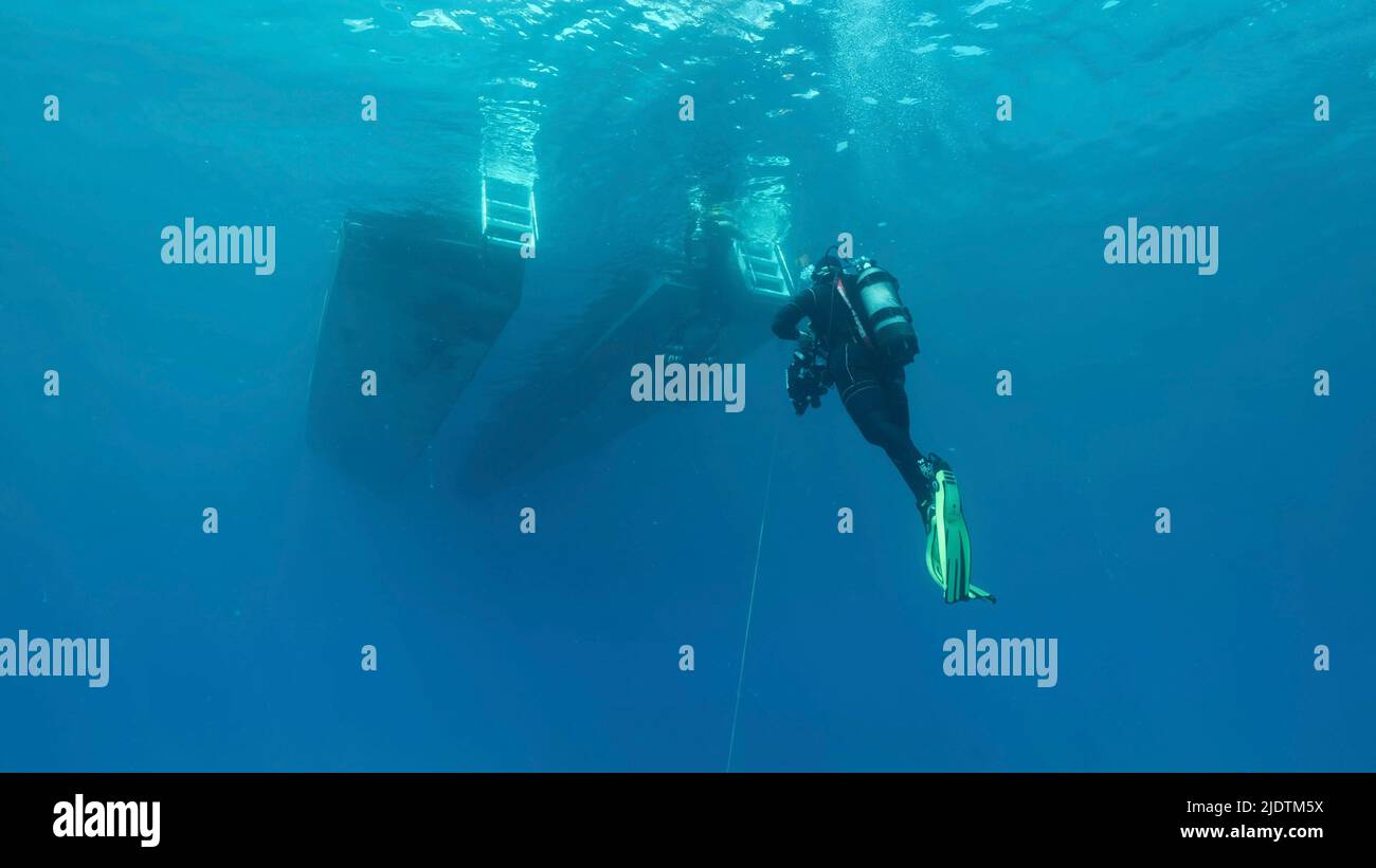 Mediterranean Sea, Cyprus. 23rd June, 2022. Scuba diver swim towards diving boat in blue water. Mediterranean Sea, Cyprus (Credit Image: © Andrey Nekrasov/ZUMA Press Wire) Stock Photo
