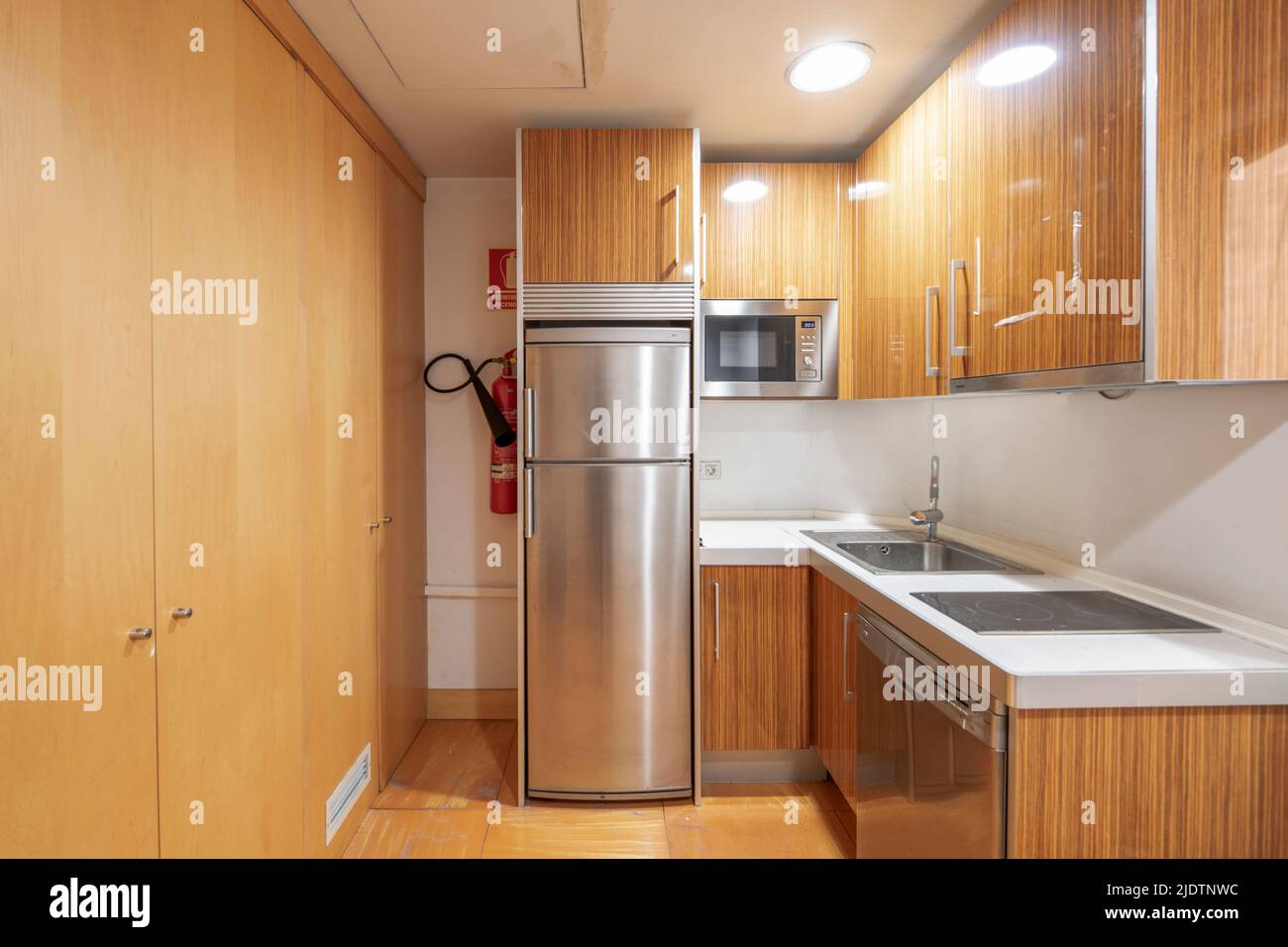 An office kitchen with shiny formica stainless steel