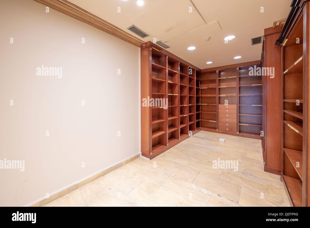 File room with shelves with many compartments and wooden drawers in a