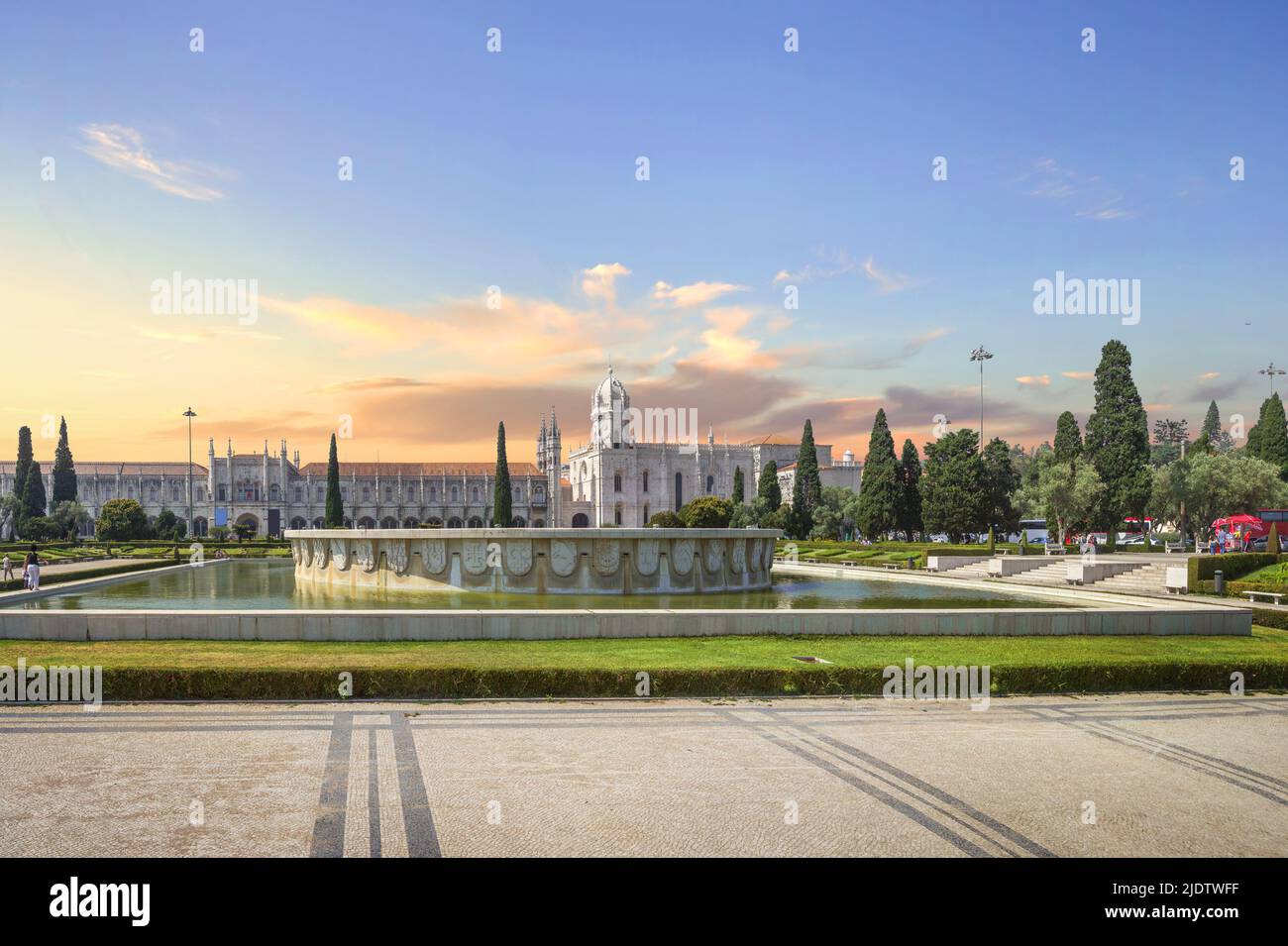 Empire Square with the fountain in the center and Jeronimos Monastery on the background. Belem, Lisbon, Portugal Stock Photo