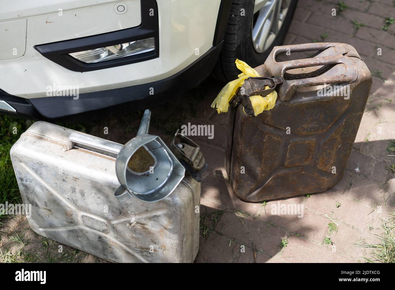 fuel canister and watering can Stock Photo Alamy