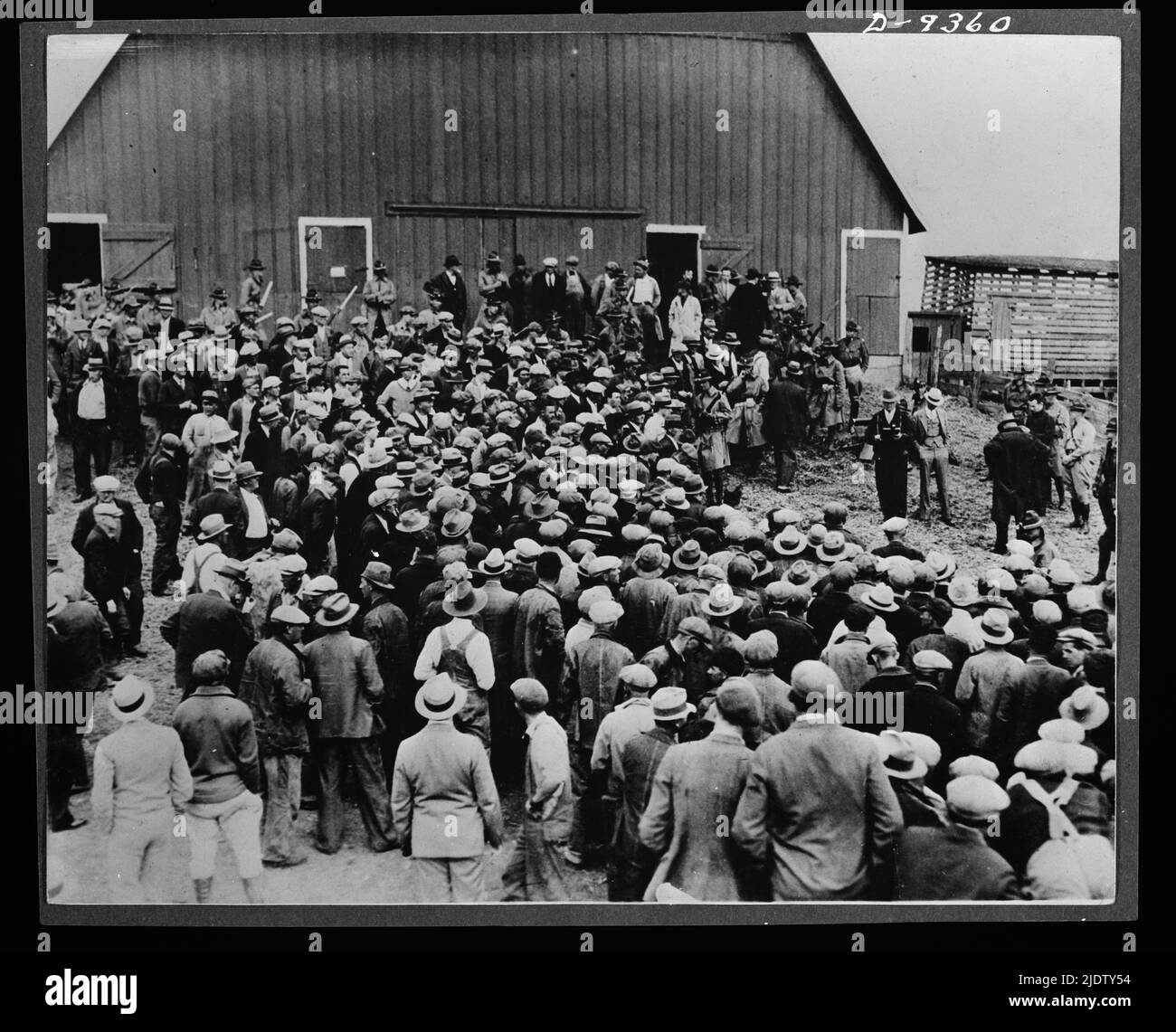 Inflation. Aftermath of inflation--a foreclosure tale in Iowa in the early 1930s when 'the bottom fell out of everything.' Military police were on hand to keep farmers from preventing the auction, Iowa, circa 1931. Stock Photo