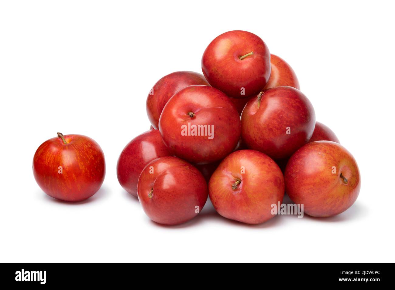 Heap of fresh sweet cherry plums isolated on white background close up Stock Photo