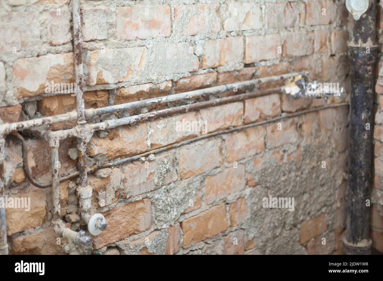 old-rusty-water-pipes-and-sewage-pipe-ex