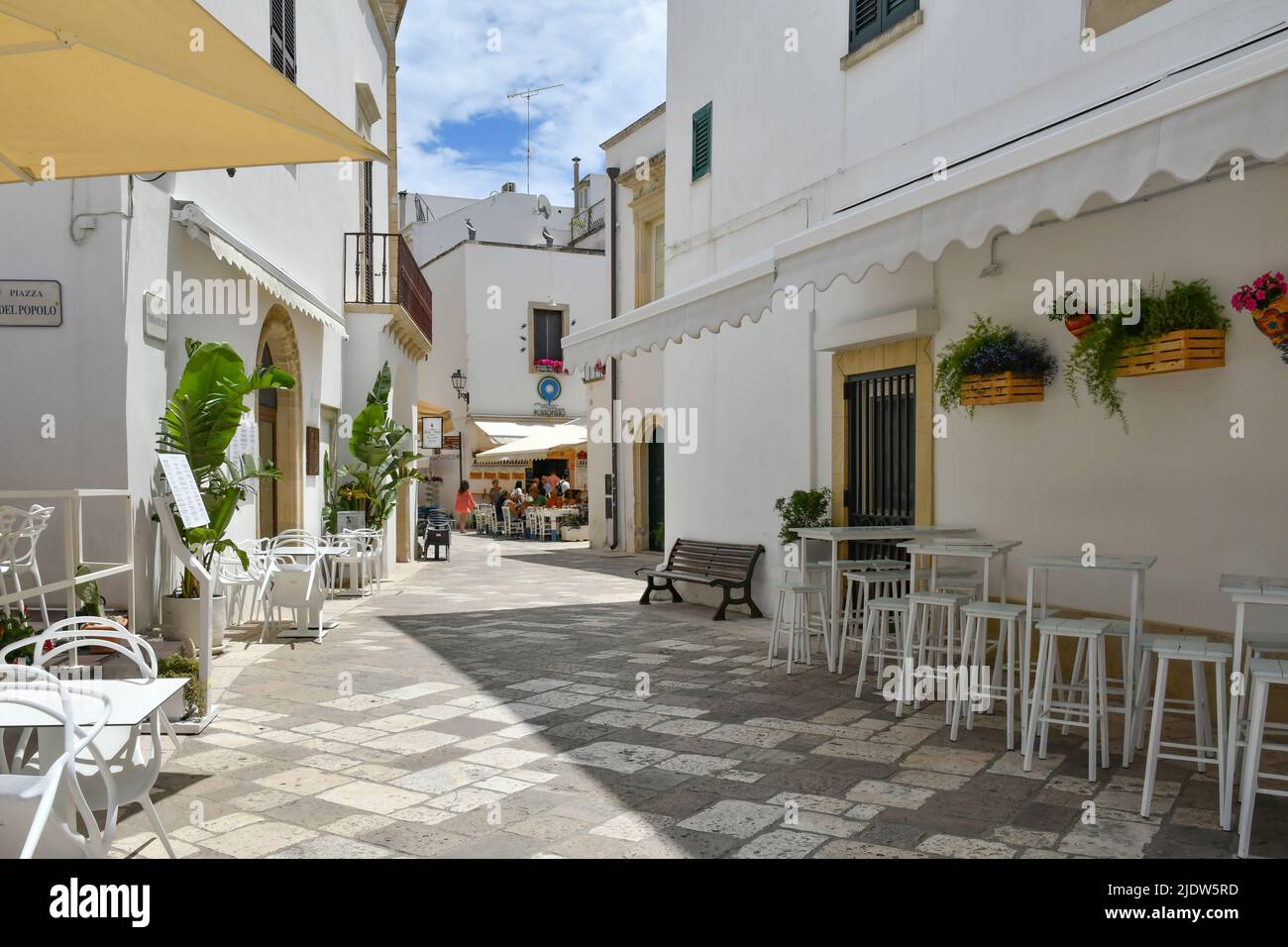 A narrow street among the old houses in the historic center of Otranto
