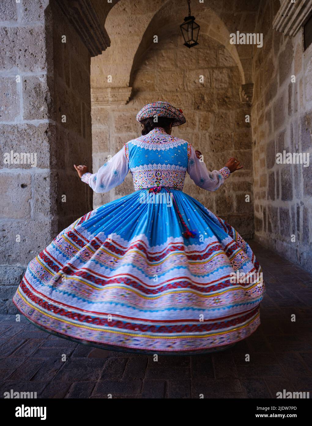 AREQUIPA, PERU - CIRCA SEPTEMBER 2019: Young Peruvian woman dancing Wititi in traditional costumes. Stock Photo