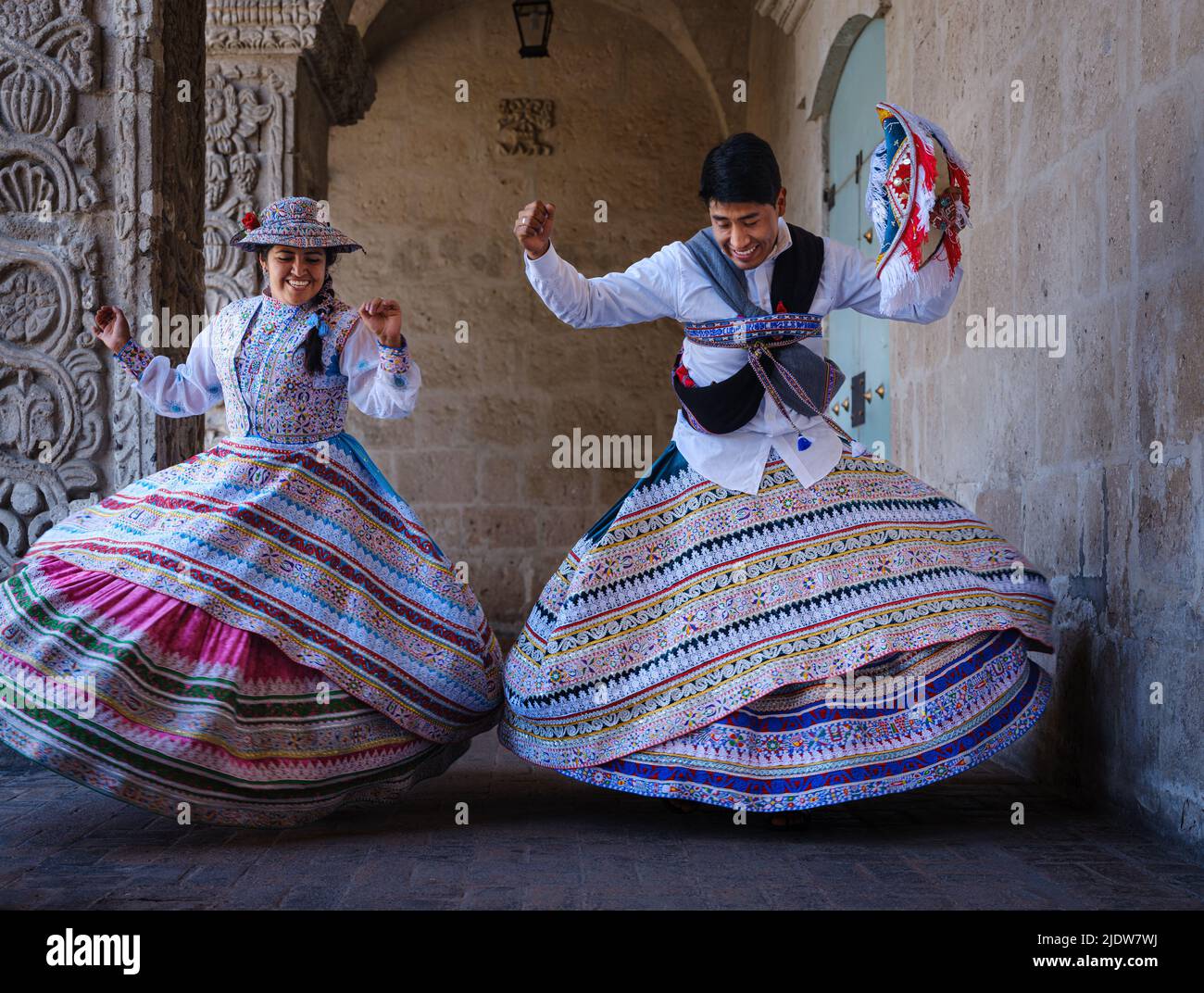 AREQUIPA, PERU - CIRCA SEPTEMBER 2019: Young Peruvian couple dancing Wititi in traditional costumes. Stock Photo
