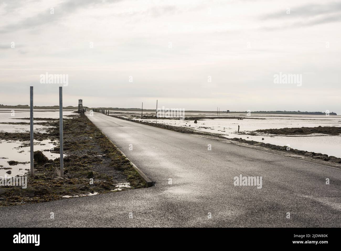 Causeway from mainland to Lindisfarne (Holy Island) Northumberland, England, at low tide. Stock Photo