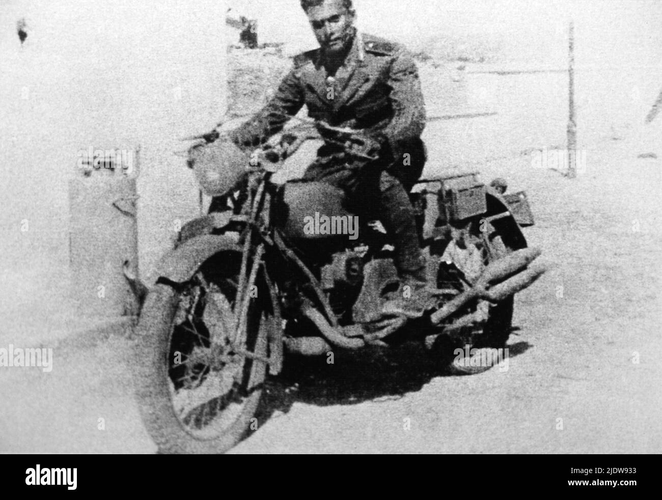 1940 , Tripoli , Lybia : The military vicebrigadiere Carabiniere SALVO D'ACQUISTO ( 1920 - 1943 ) during the military service. Killed for save 22 hostages from Nazi , Medaglia d' Oro al Valor Militare - EROE - HERO - WORLD WAR II - WW 2nd - SECONDA GUERRA MONDIALE - nazismo - nazism - RESISTENZA - processo di beatificazione  - portrait - ritratto - bicher - moto - motocicletta - motociclista - DACQUISTO - D' ACQUISTO ----  Archivio GBB Stock Photo