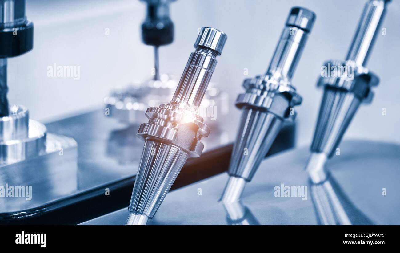 Industrial metalworking concept background, shiny metal shaft and ...