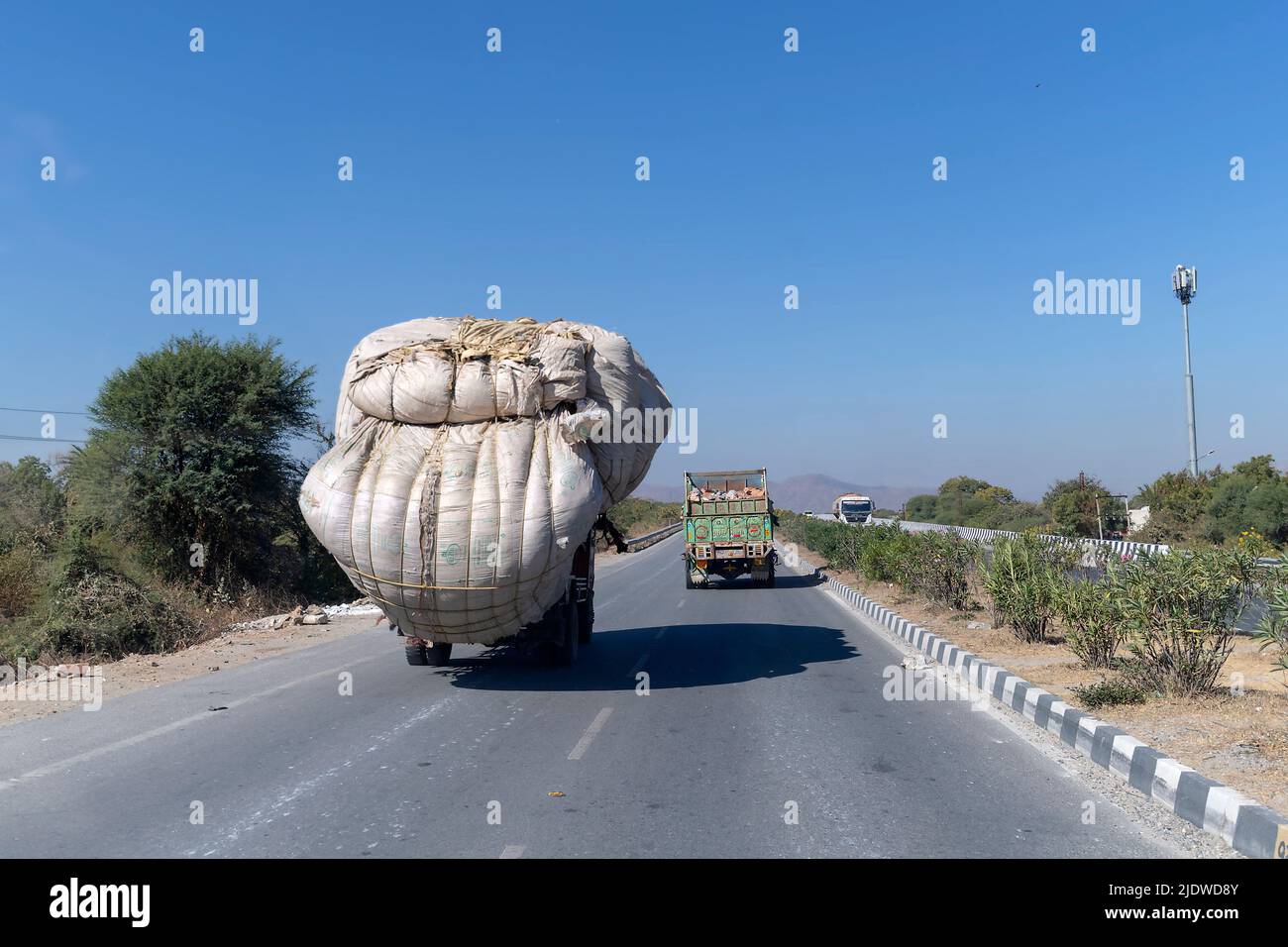 On the road again. Scene from Highway 27, Amberi, Rajasthan, India. Stock Photo