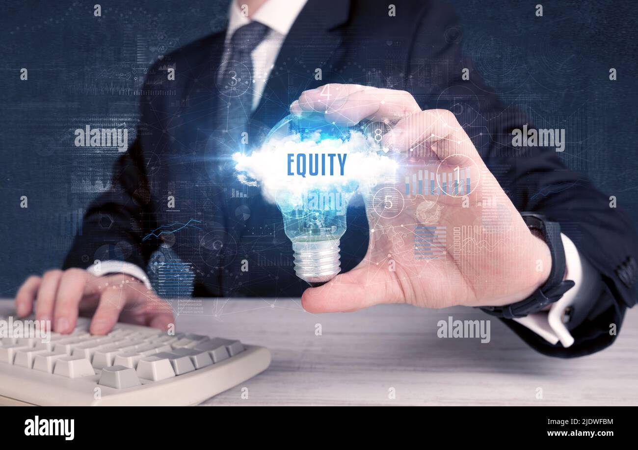 Businessman holding a light bulb, business concept Stock Photo - Alamy