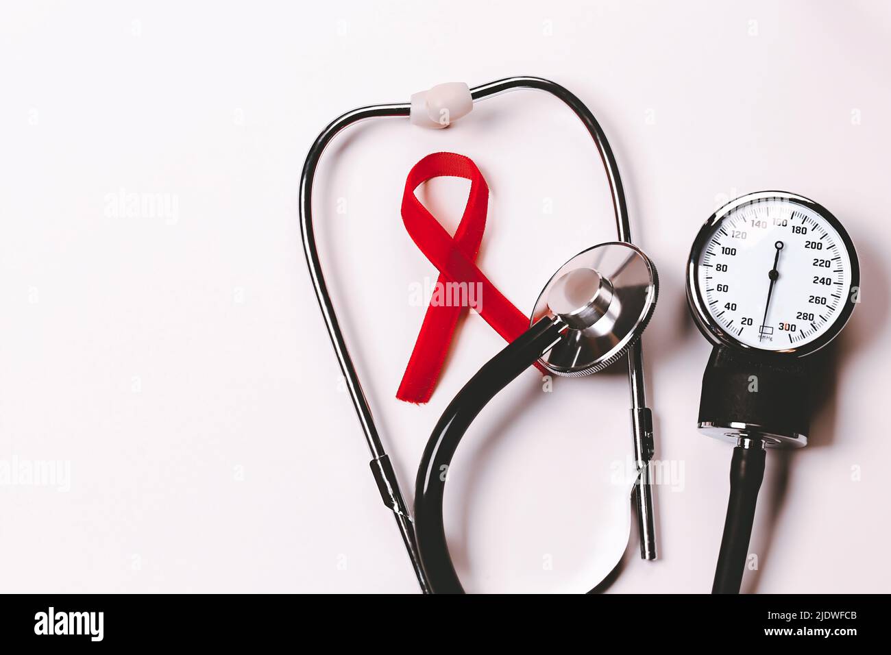 Aids Awareness Sign Red Ribbon. World Aids Day , 1 December,HIV. Symbol of awareness, charity, support in disease, illness, ill. Medical health care Stock Photo