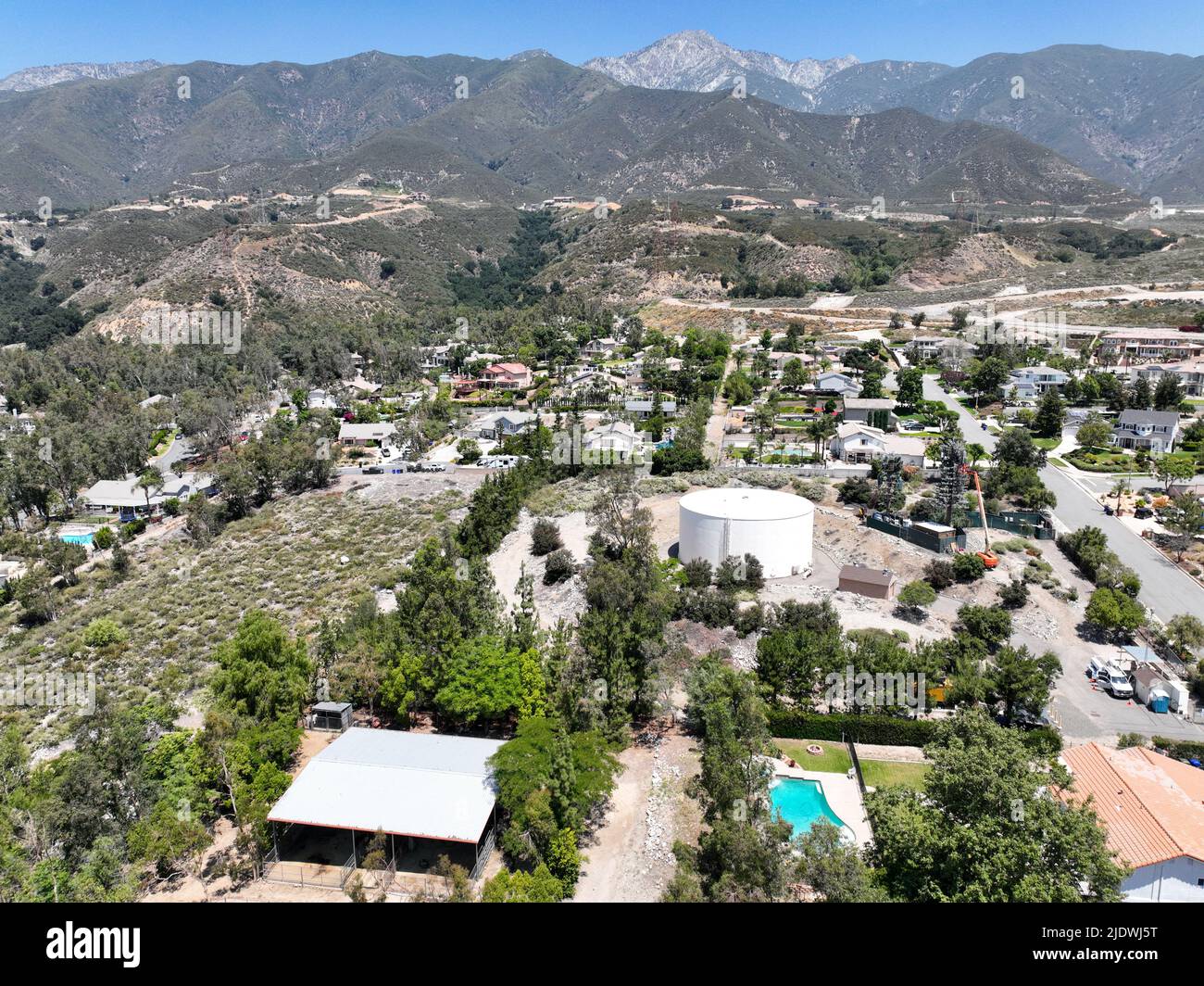 Aerial view of wealthy Alta Loma community and mountain range, Rancho
