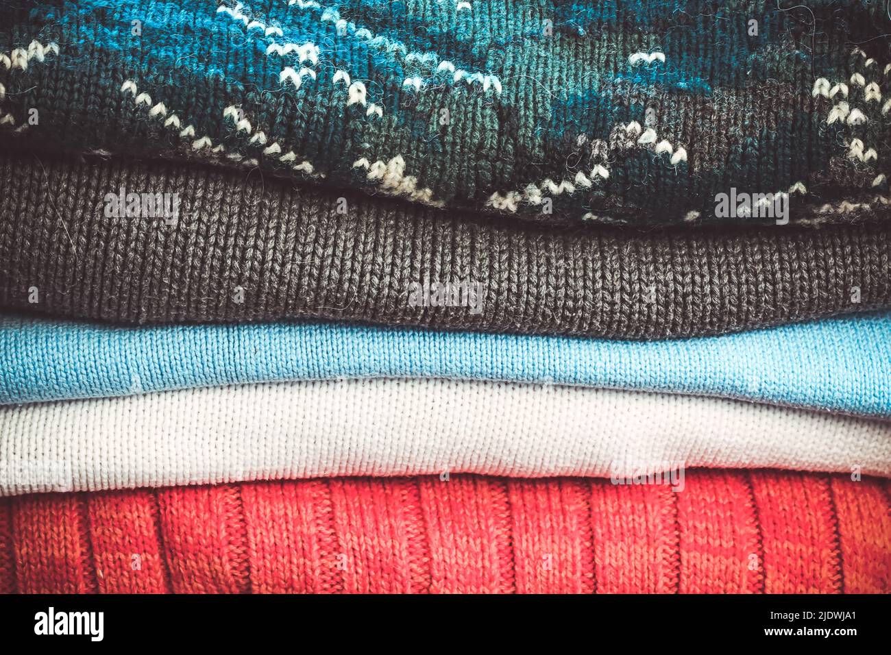 Warm knitted sweaters for autumn and winter weather Stock Photo