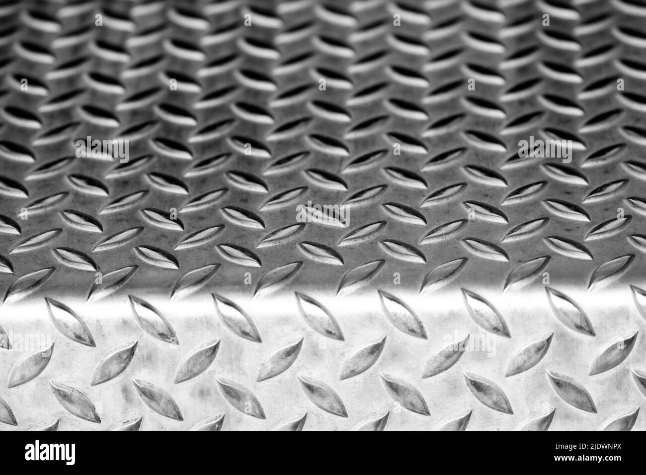 Solid diamond metal plate surface shows stainless steel flooring in industrial manufactury as