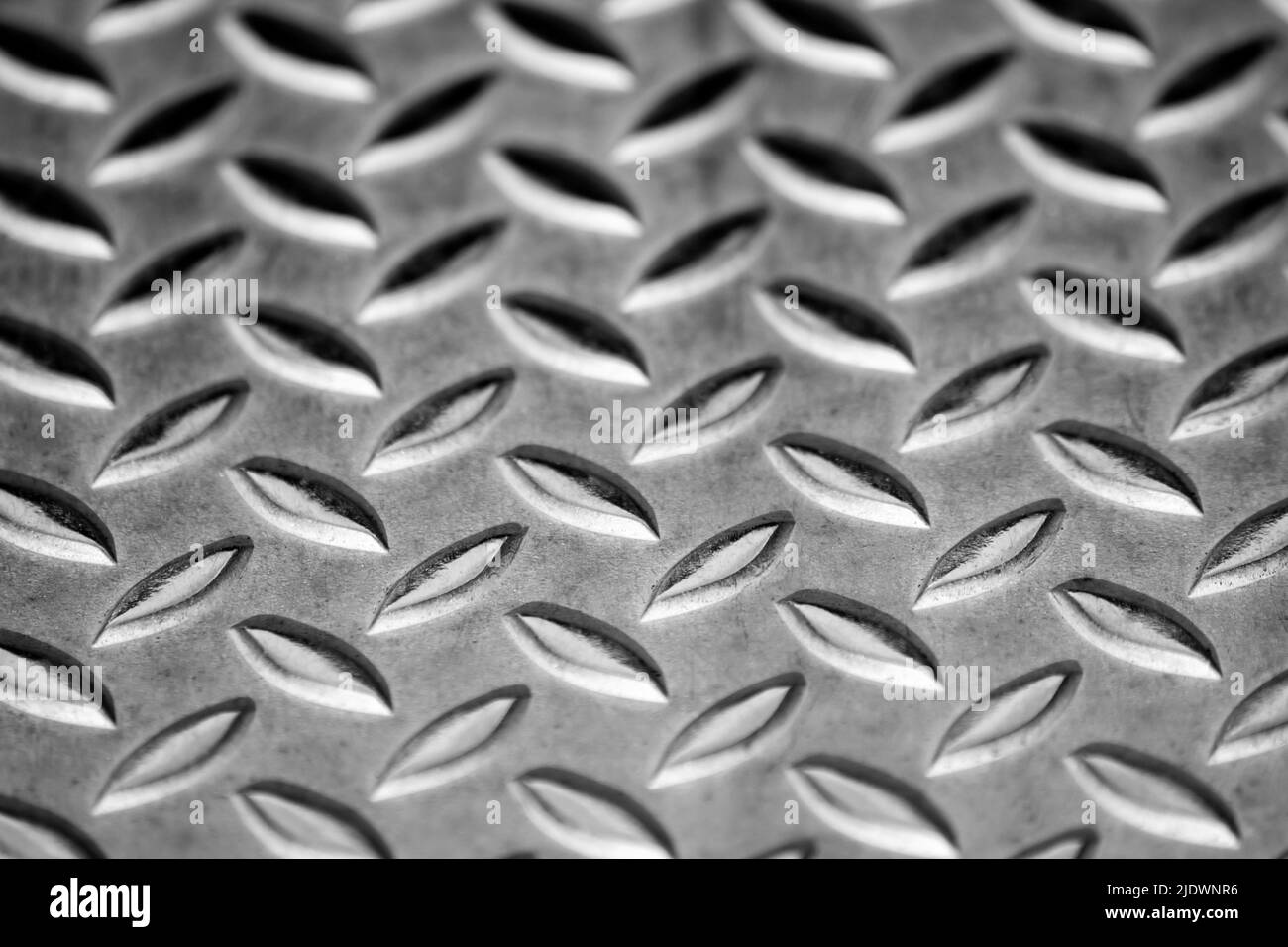 Solid diamond metal plate surface shows stainless steel flooring in industrial manufactury as steampunk background for metal stairs and heavy steel Stock Photo