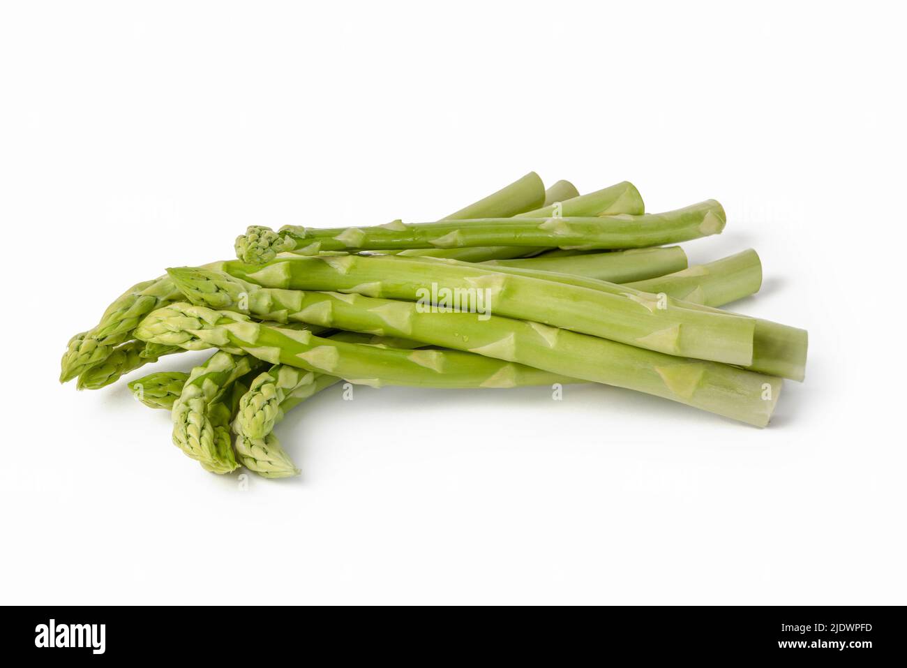 Fresh green asparagus on a white isolated background. Green asparagus isolate with shadow on white background. Stock Photo