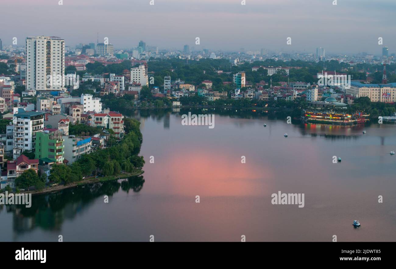 Skyline of Hanoi in Vietnam with hoam kiem lake late in the evening Stock Photo