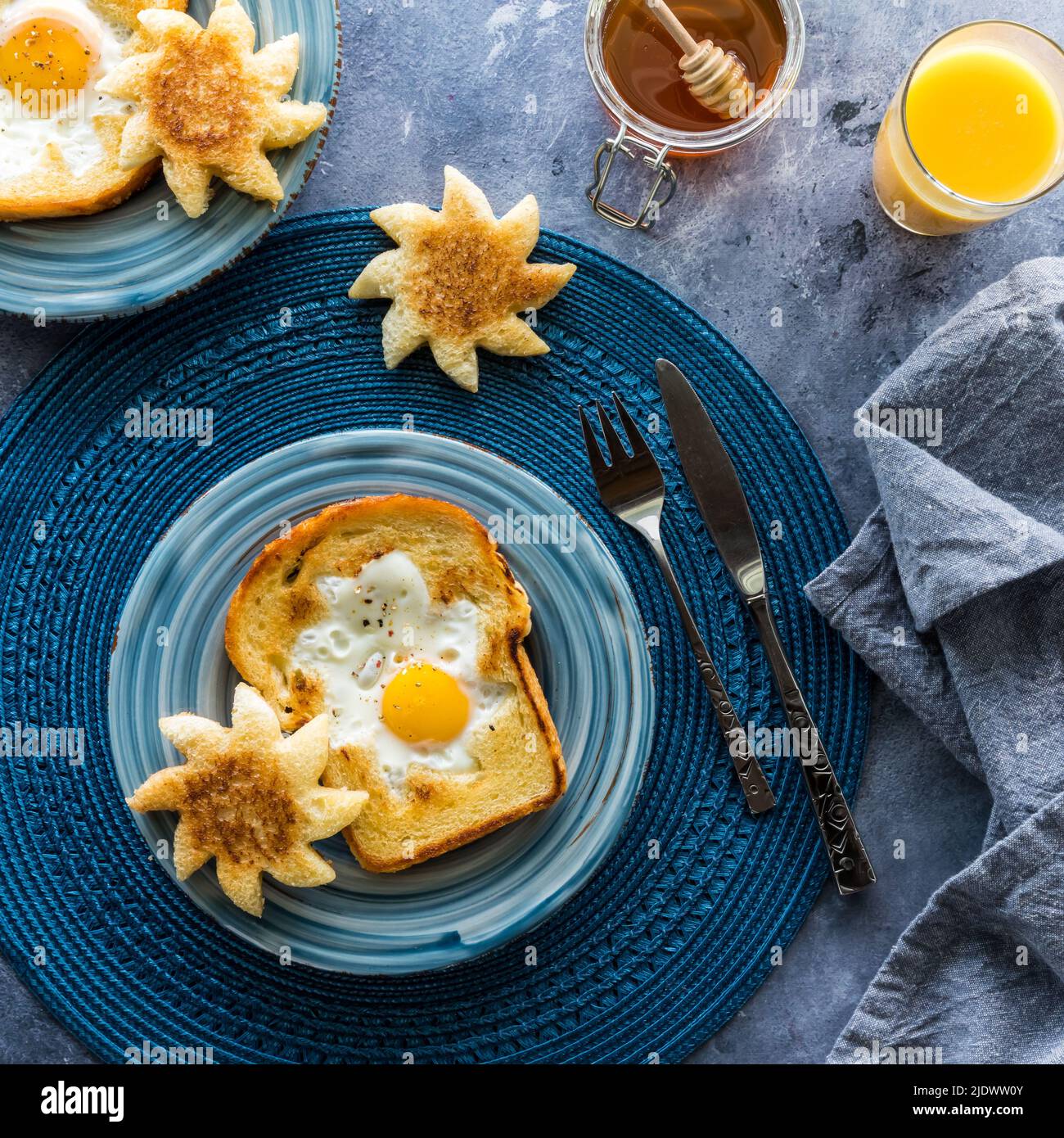 Top down view of a sunshine toast with a fried egg in the middle Stock