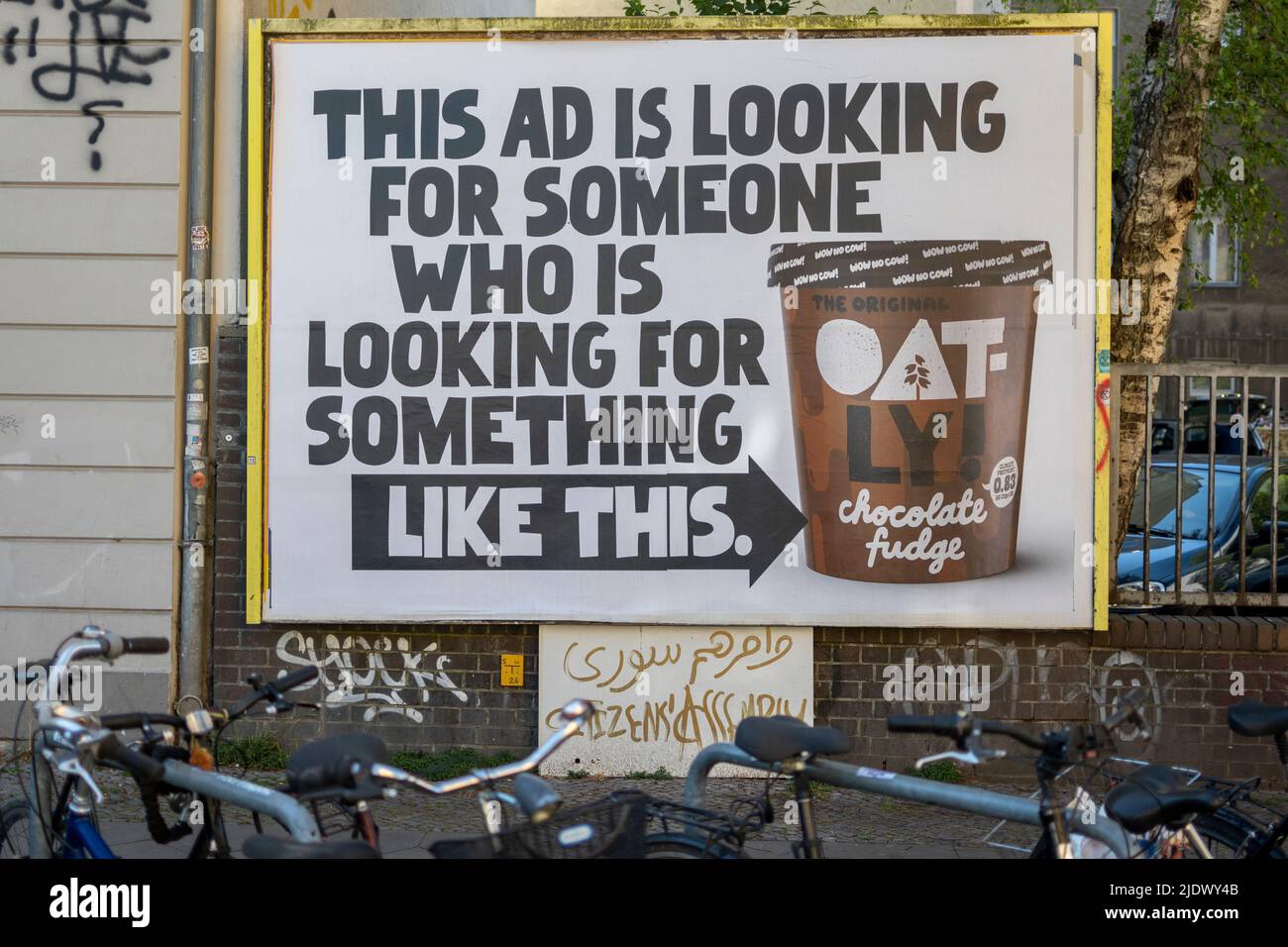 Berlin, Germany, June 2022, Illustrative Editorial: Big ad for Oatly plant based and vegan ice cream in the streets of a city Stock Photo