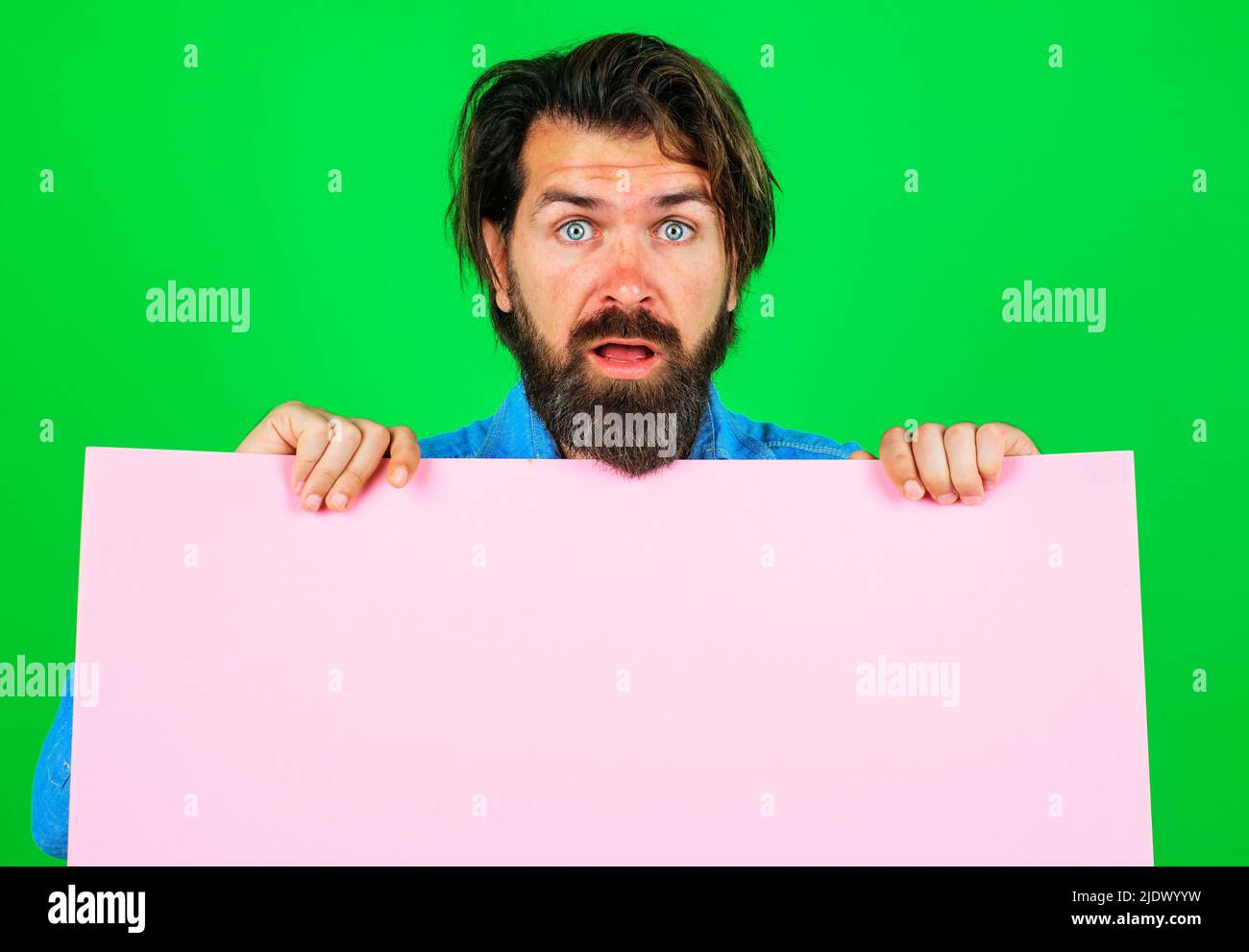 Surprised bearded man with empty board. Online shopping. Advertising banner. Season sales. Stock Photo