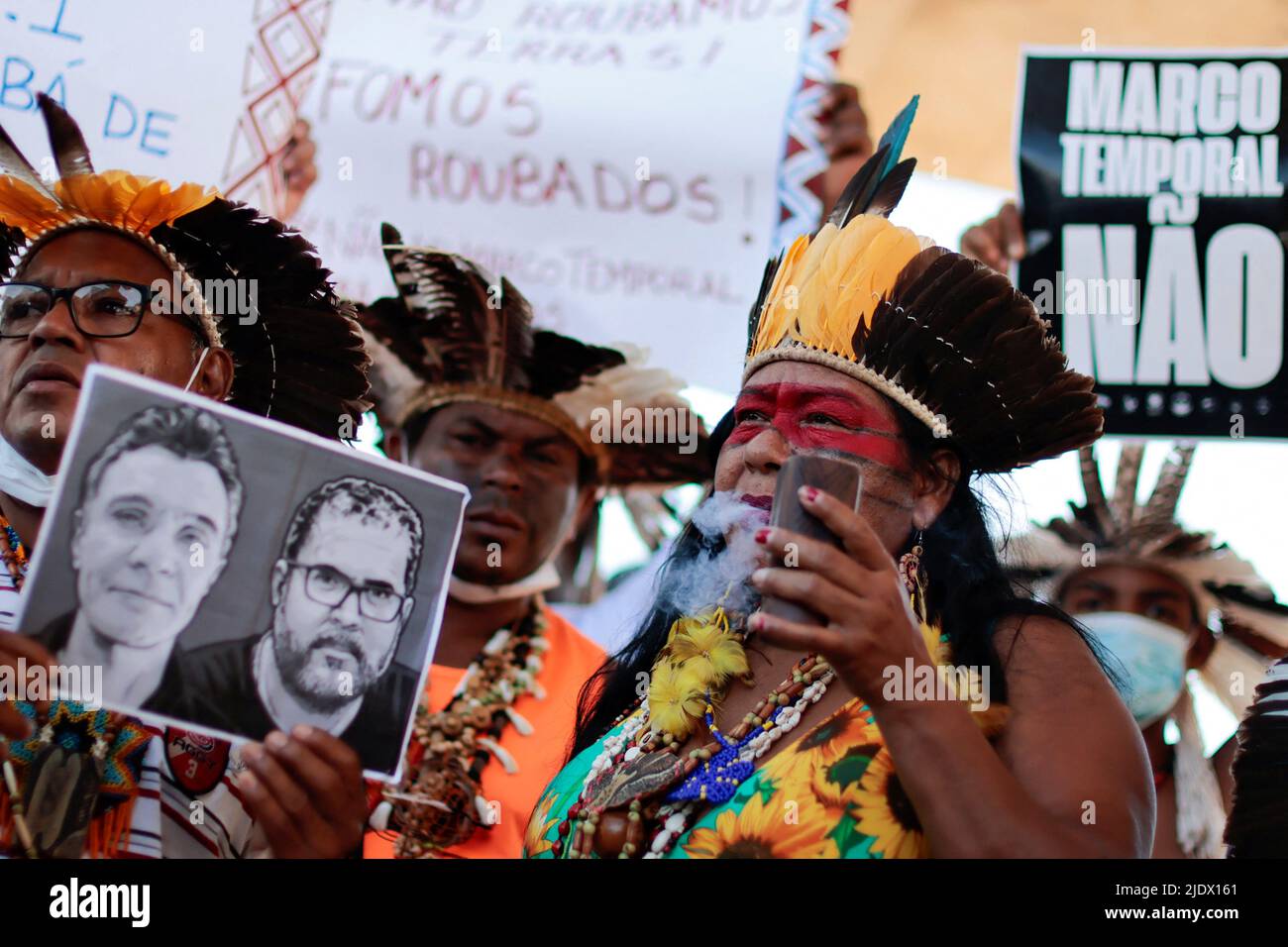 Indigenous people take part in a protest against Brazilian President Jair Bolsonaro's government, Brazil's National Indian Foundation (FUNAI)'s President Marcelo Augusto Xavier da Silva, to ask the Supreme Court to define the demarcation of Indigenous lands and to demand justice for journalist Dom Phillips and indigenous expert Bruno Pereira, who were murdered in the Amazon, in Brasilia, Brazil, June 23, 2022. REUTERS/Ueslei Marcelino Stock Photo