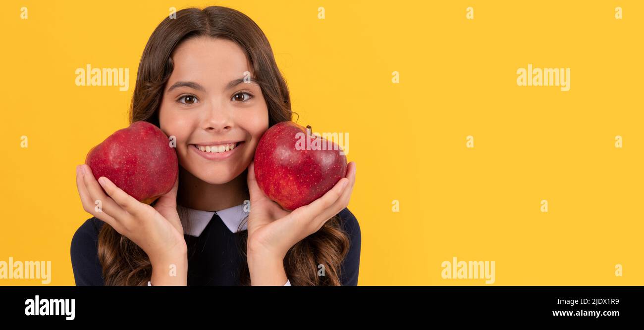 diet and kid beauty. dental care. lunch break. detox. cheerful teen girl with apple fruit. Child girl portrait with apple, horizontal poster. Banner Stock Photo