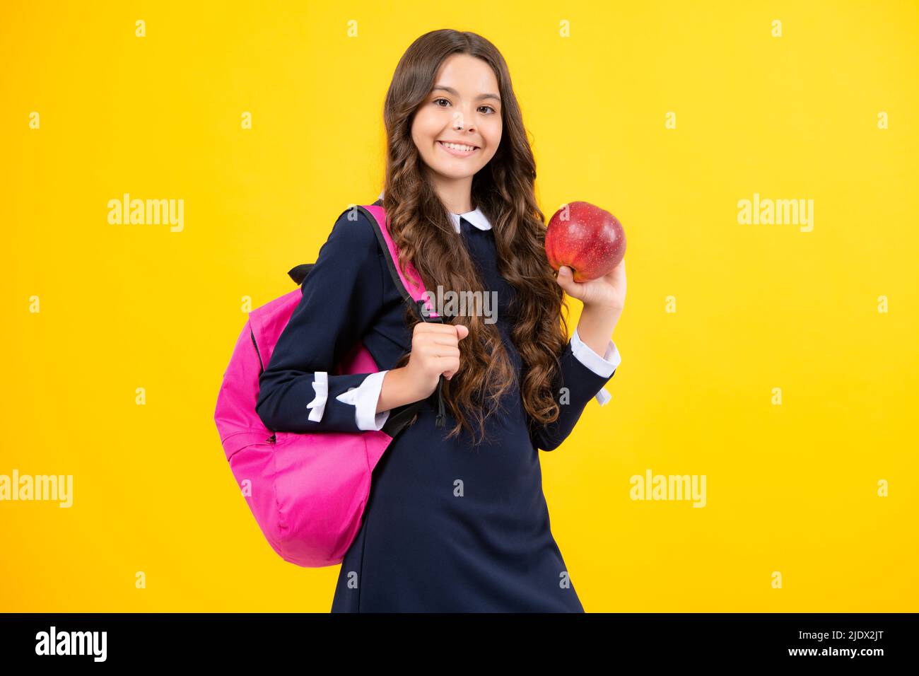 Back to school. Teenager school girl with backpack hold aplle ready to ...