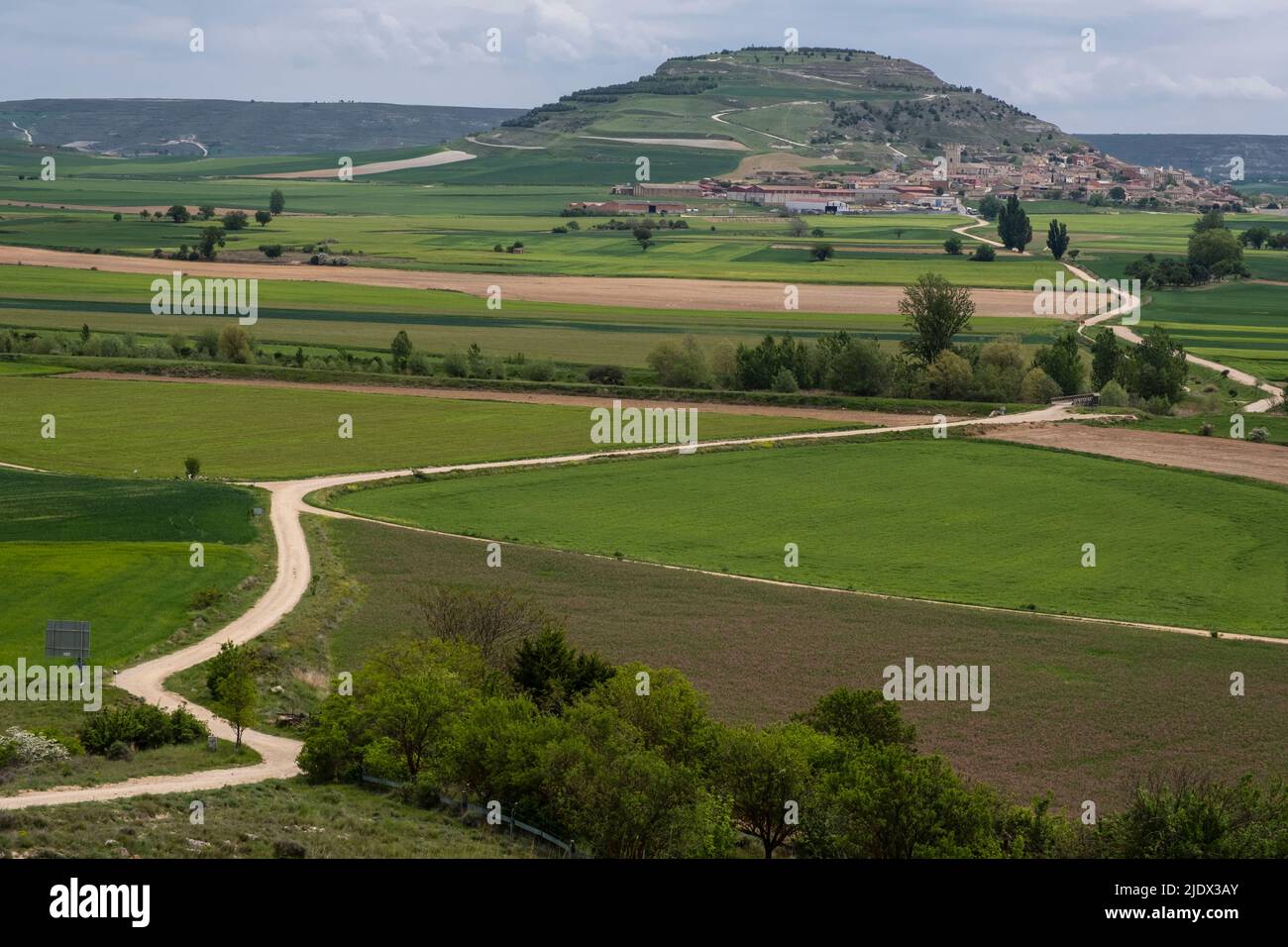 Spain, Castilla y Leon, Looking toward Castrojeriz from the Camino de Santiago, going through Farmland in foreground. Stock Photo