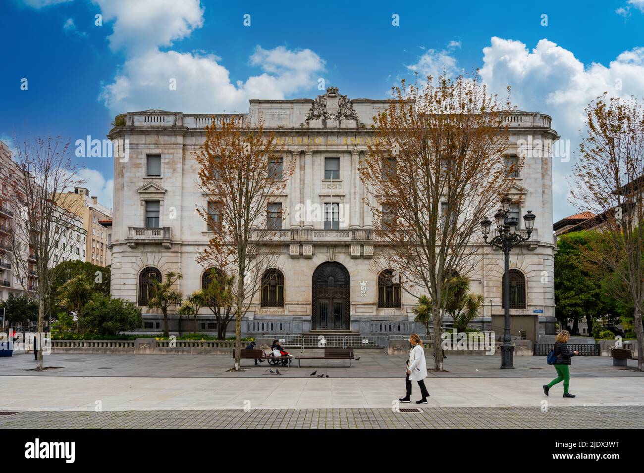 Santander, Spain - May 4th 2022 - People passing the Front of the Bank of Spain in Santander Stock Photo