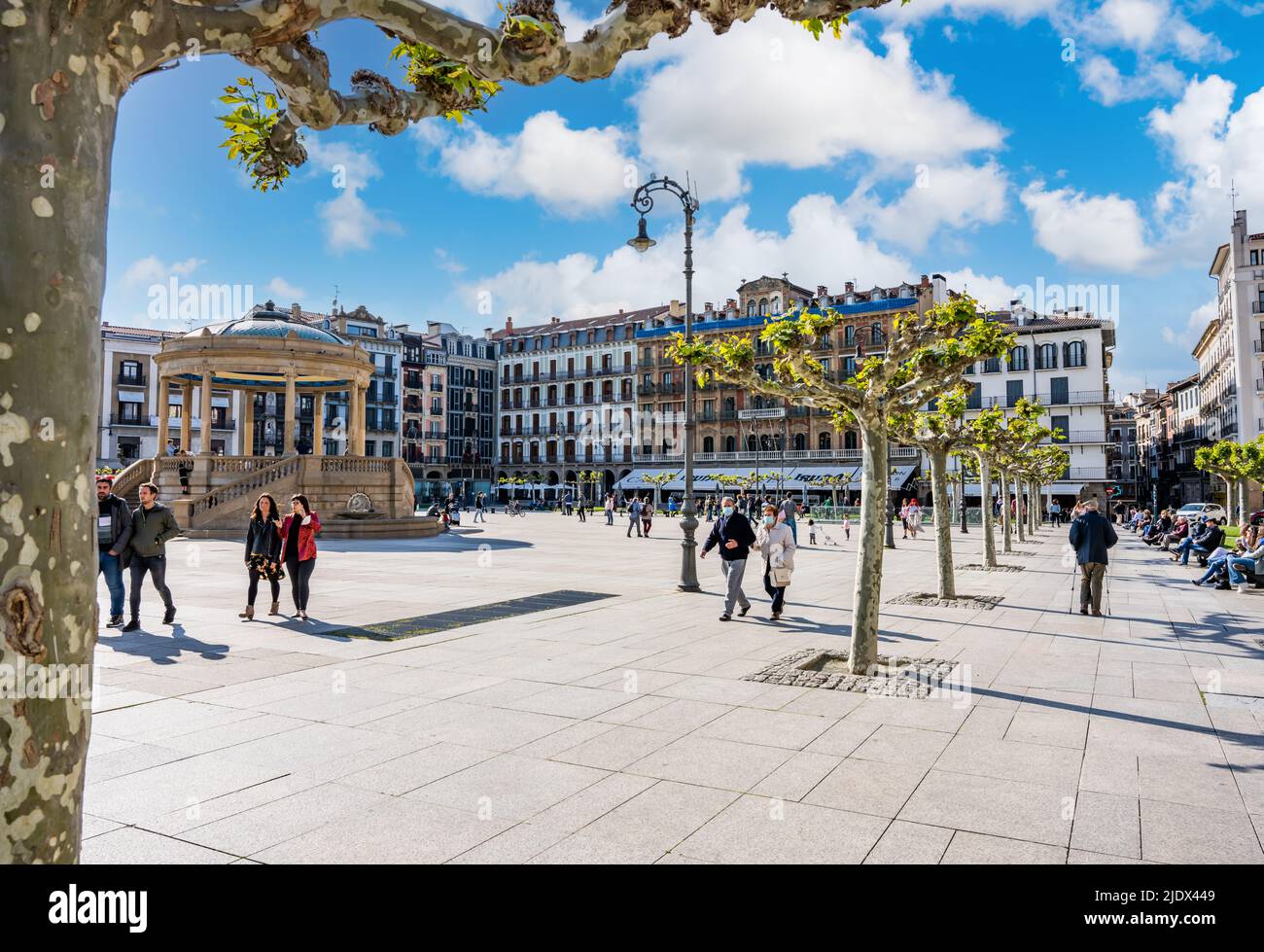 Pamplona, Spain - May 6th 2022 - Tourists passing on the Castillo square (Placa de Castillo) in Pamplona Stock Photo