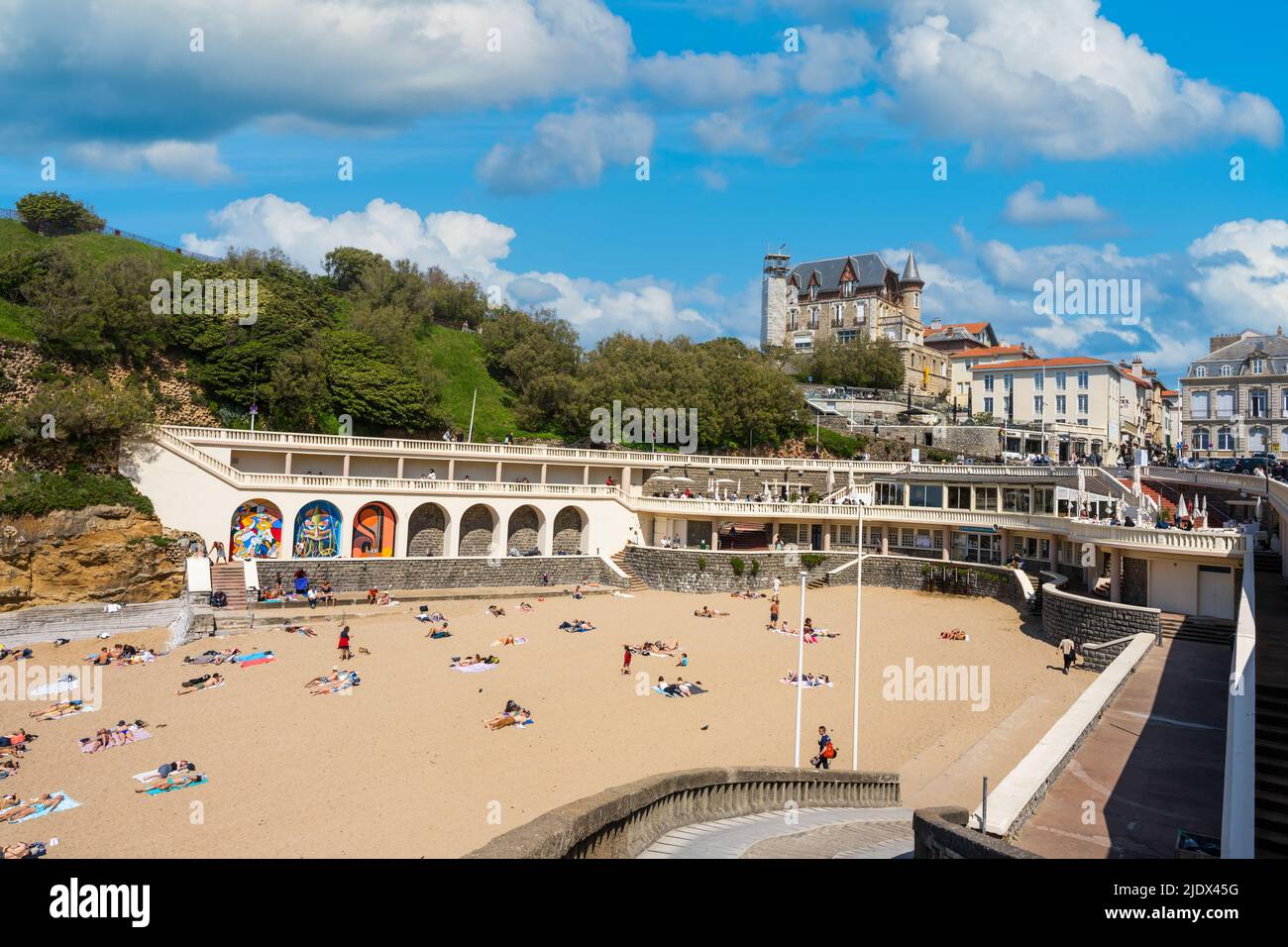Biarrtiz, France - May 7th 2022 - Port Vieux Beach (Plage du Port Vieux) with sun lovers in Biaritz Stock Photo