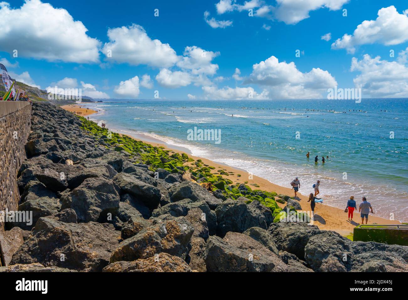 Biarrtiz, France - May 7th 2022 - Bask coast beach (Plage de la Cote des Basques) with surfers in Biaritz Stock Photo