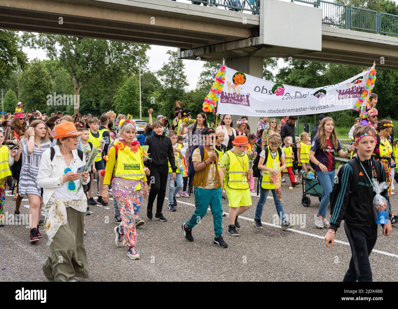 Lelystad, The NEtherlands - June 10 2022, Children with parents walking the last day of the four day evening walking tournament Stock Photo