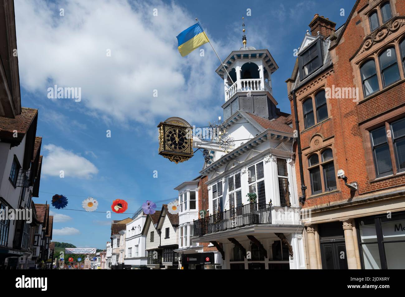 Guildford High Street with the Guildhall (16th Century Grade I listed) and John Aylsward's clock, Guildford, Surrey, England, UK Stock Photo