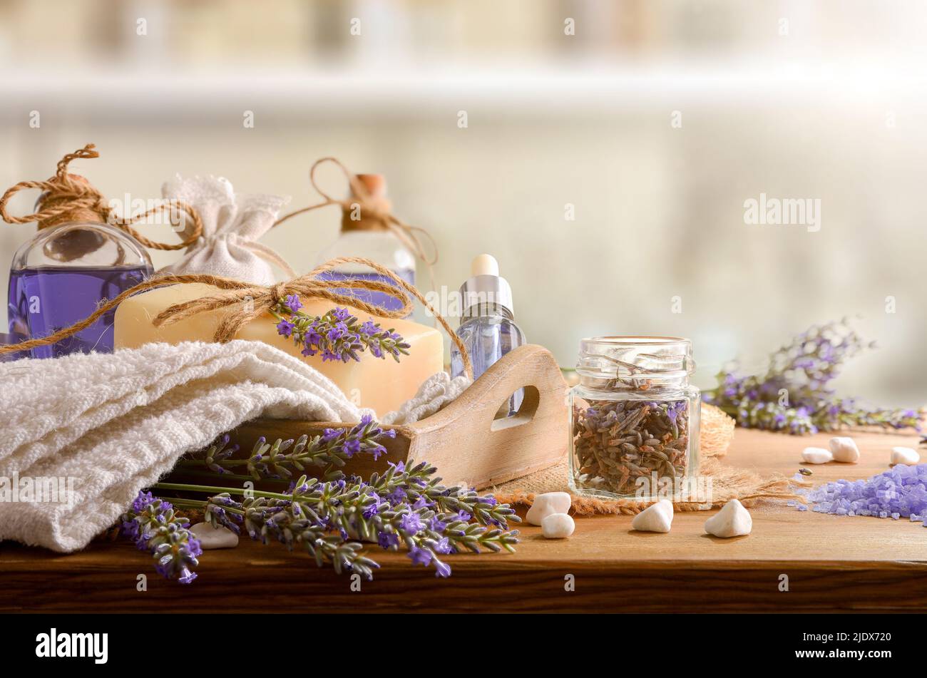 Set of natural lavender body care products on wooden table. Front view. Horizontal composition. Stock Photo