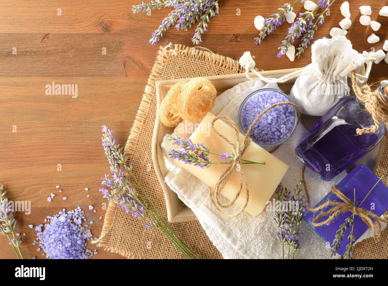 Set of natural lavender body care products on wooden table. Top view. Horizontal composition. Stock Photo