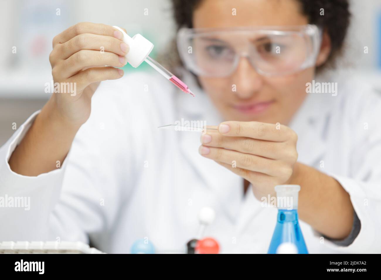 female scientist using pipettes in lab Stock Photo Alamy