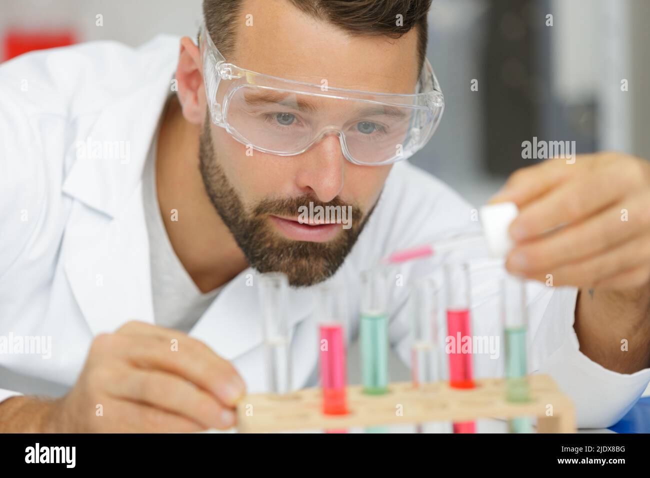 man using pipette in lab Stock Photo Alamy