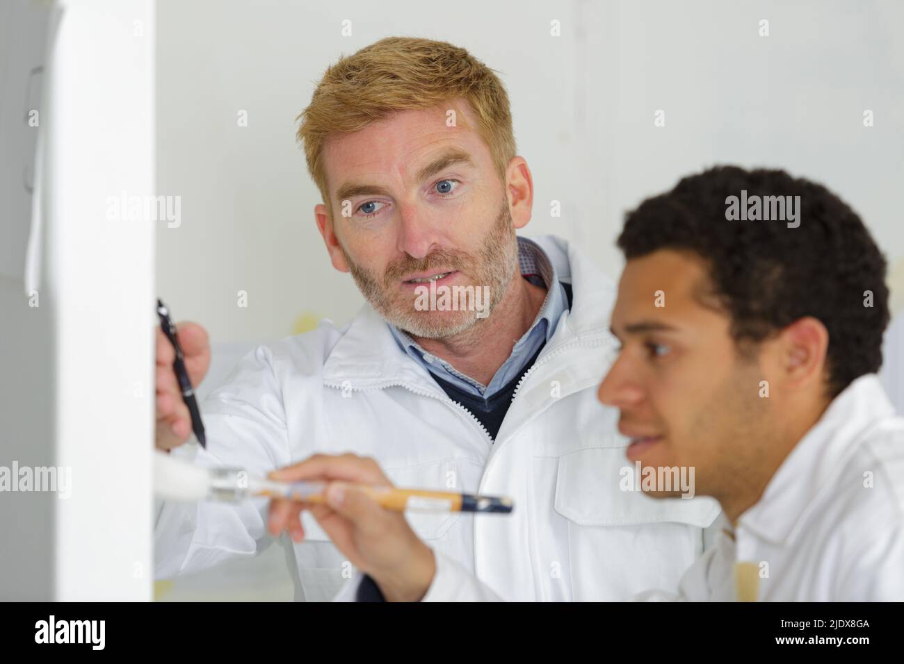 portrait of painter with apprentices Stock Photo - Alamy